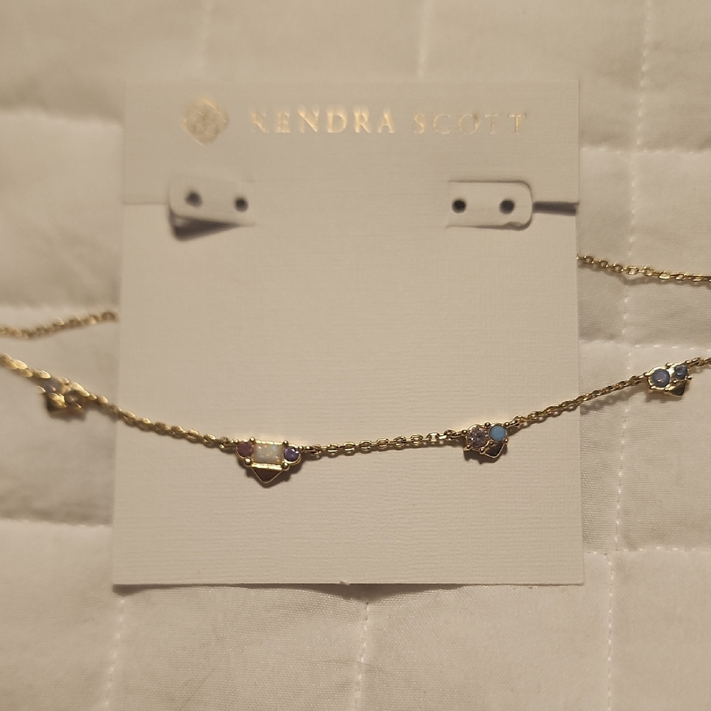 Kendra Scott Gold and Blue Necklace with Delicate Design